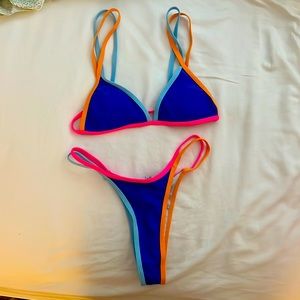 Blue bikini with orange and neon pink